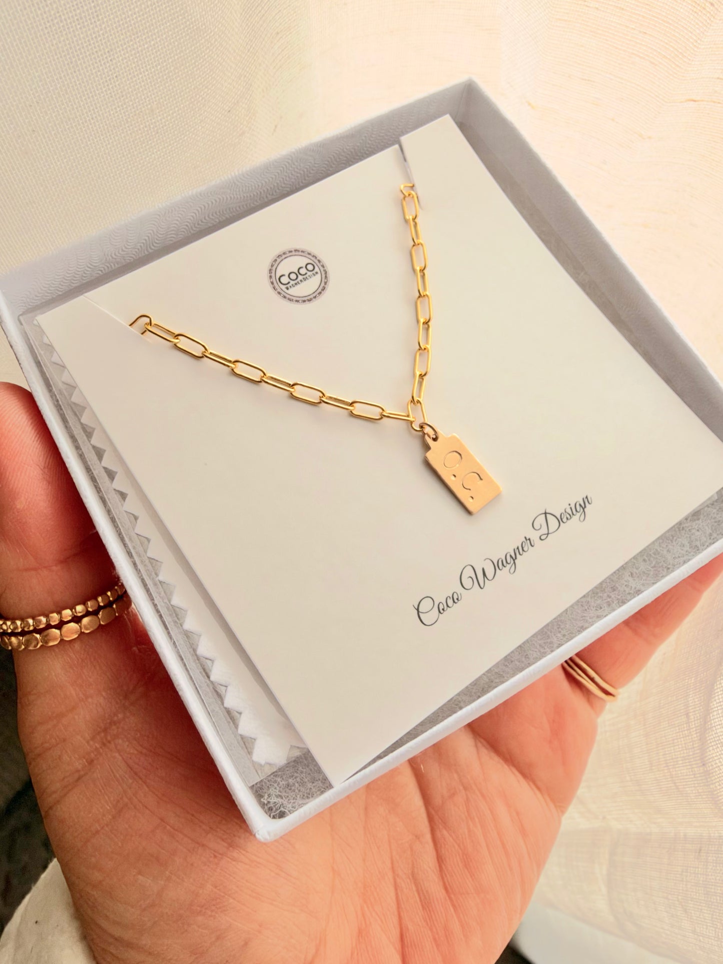 Personalized Mini Tag Necklace is handcrafted with high-quality 14K gold filled or sterling silver, featuring a dainty hand-stamped tag with your favorite initial, name, date, or meaningful symbol.