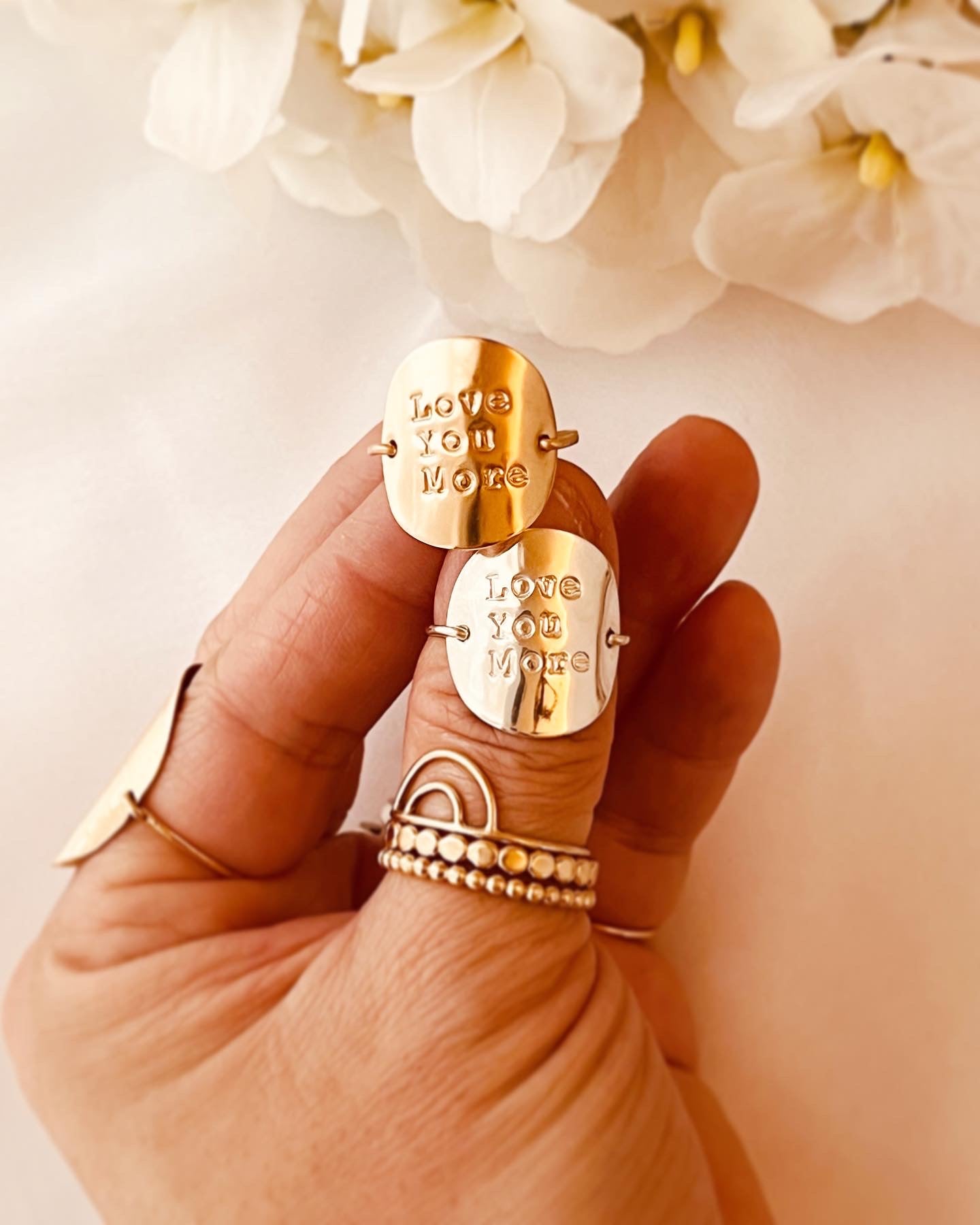 Quote Rings are an effortless way to wear personalized messages around your fingertip. Delicate and stackable, these 14k gold-filled and sterling silver rings can be custom-engraved with your favorite quotes, statements, and names. Express yourself with a unique and meaningful jewelry piece that lasts for years.