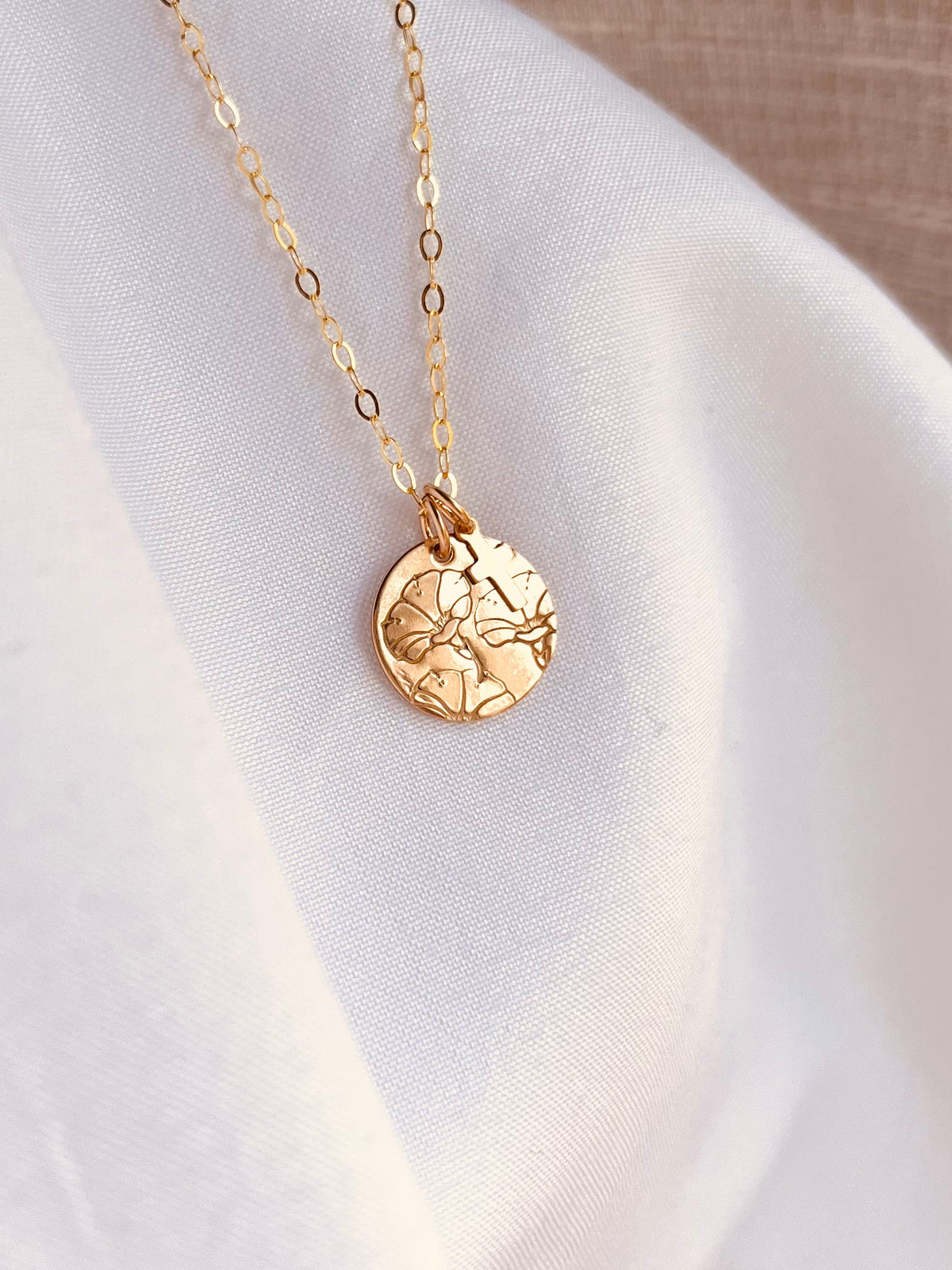 Personalized 14K gold-filled birth flower necklace with a tiny cross charm