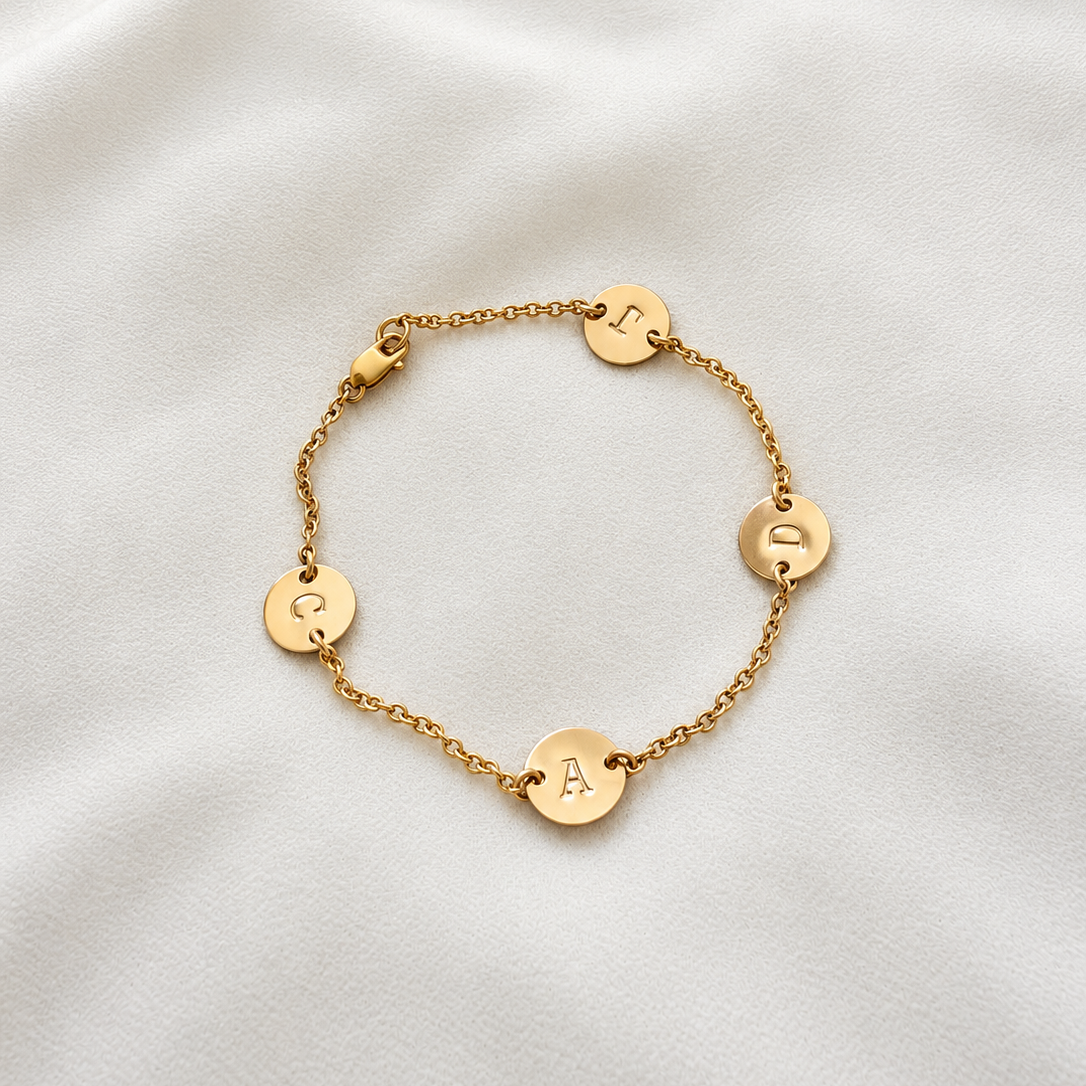 Personalized family initial disc bracelet in 14K gold filled or sterling silver. Lightweight, custom fit and made for 24/7 wear. A meaningful gift for Mom.