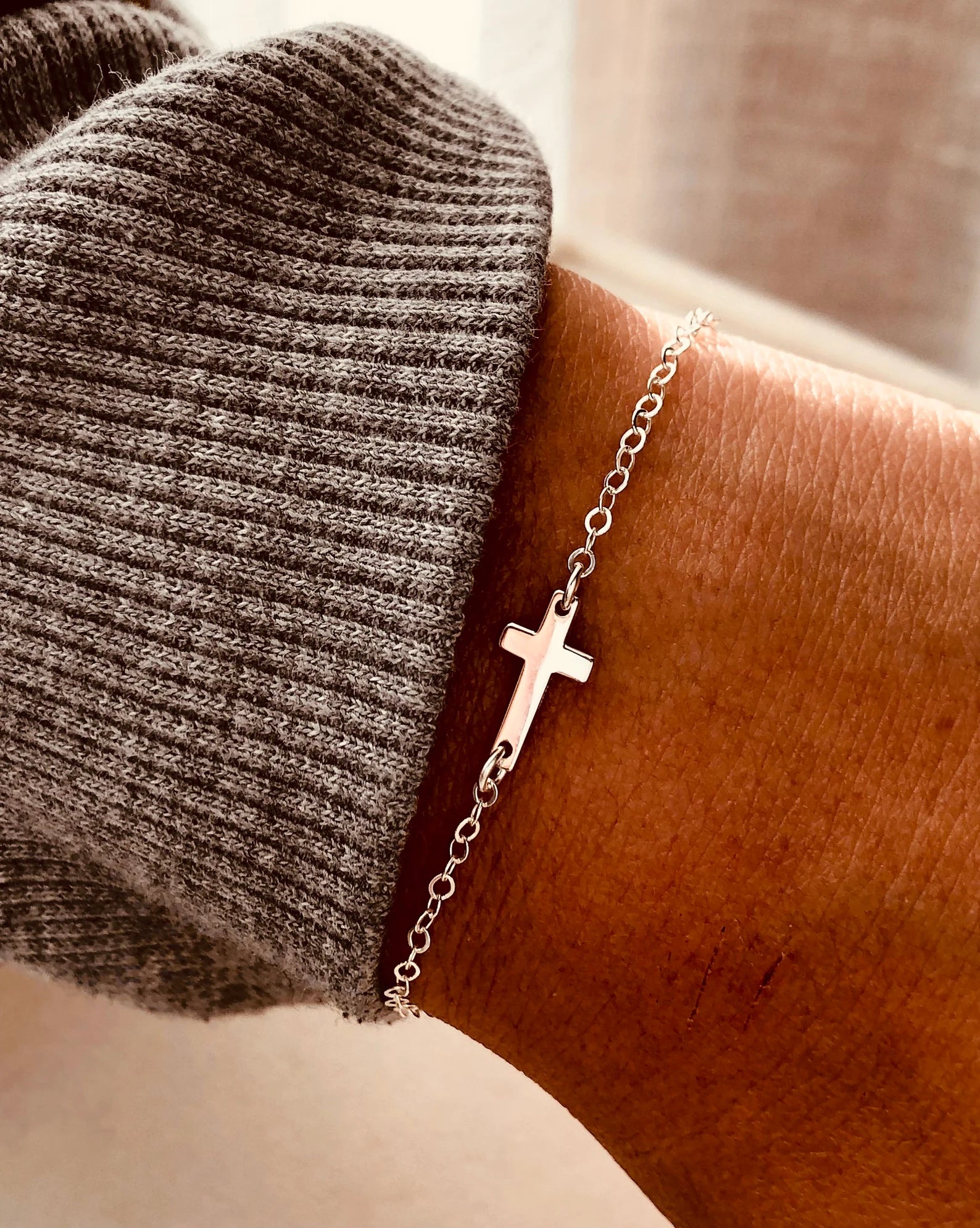delicate cross bracelet, minimalist cross bracelet, gold cross bracelet, silver cross bracelet, everyday faith jewelry, handmade Wyoming jewelry, dainty cross chain bracelet, waterproof jewelry, Coco Wagner Design