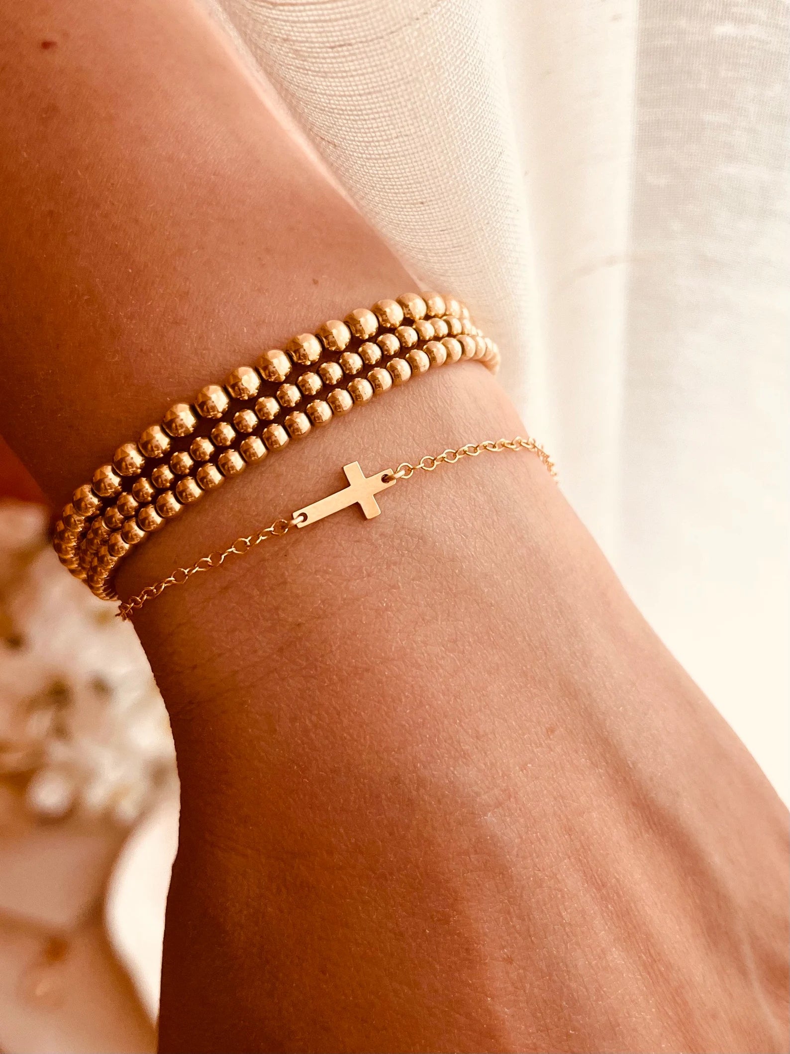 delicate cross bracelet, minimalist cross bracelet, gold cross bracelet, silver cross bracelet, everyday faith jewelry, handmade Wyoming jewelry, dainty cross chain bracelet, waterproof jewelry, Coco Wagner Design