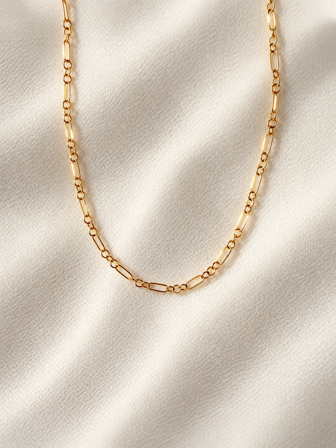 Dainty 14K gold filled chain necklace featuring alternating elongated and round links, lightweight minimalist gold necklace for layering and everyday wear.