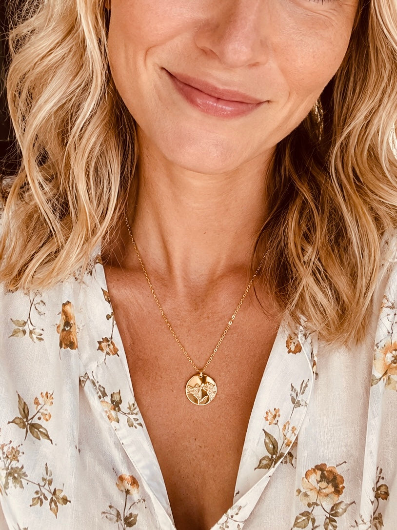 14K gold filled lily flower necklace with 15mm hand-stamped floral pendant worn as everyday jewelry