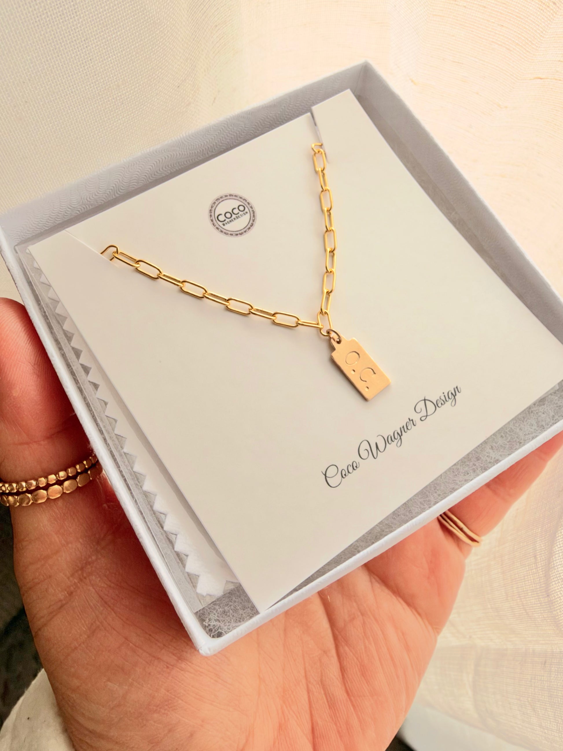 Personalized Mini Tag Necklace is handcrafted with high-quality 14K gold filled or sterling silver, featuring a dainty hand-stamped tag with your favorite initial, name, date, or meaningful symbol.