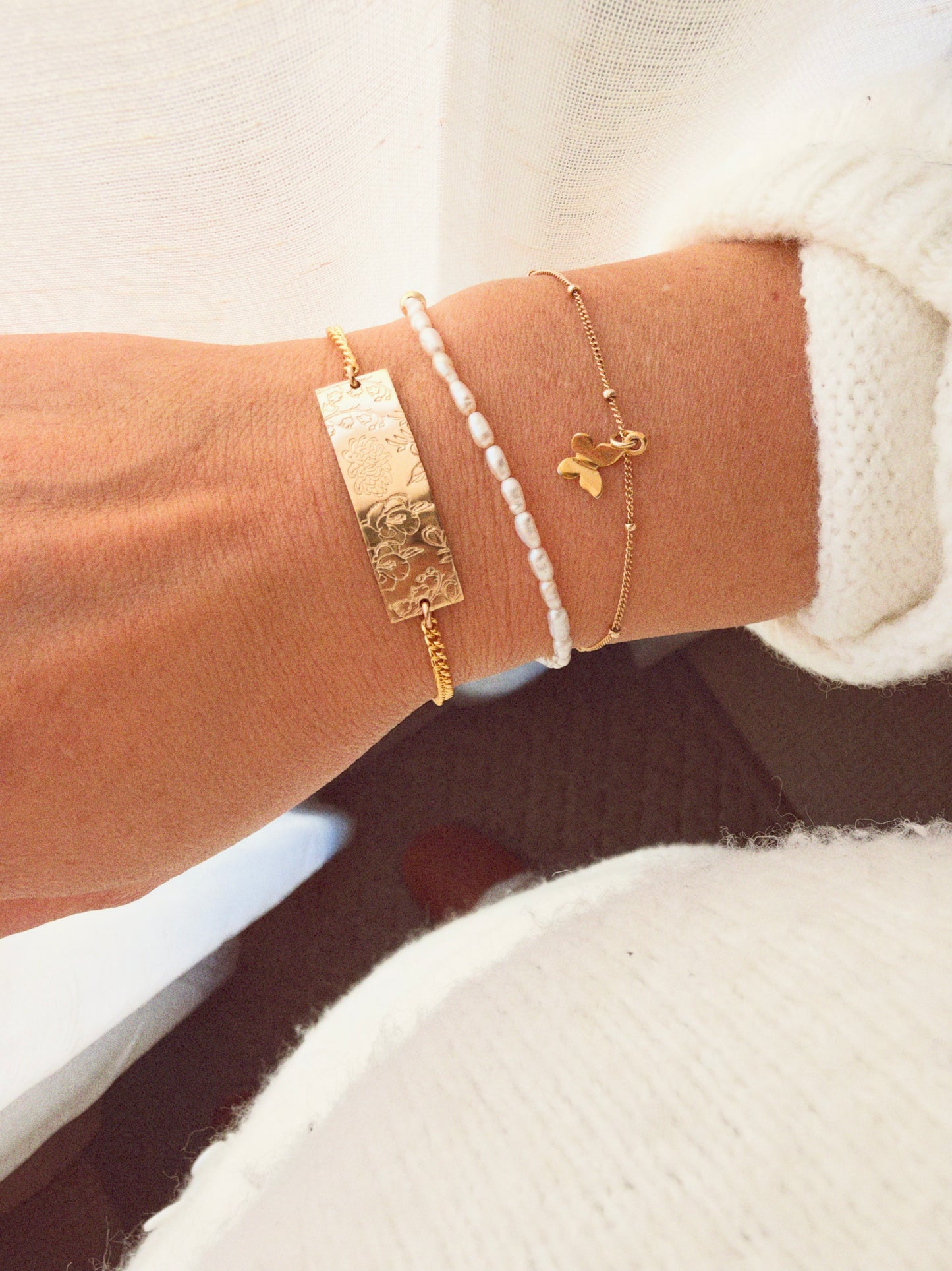 Shop a personalized 14k gold filled birth flower bar bracelet, Handmade custom family jewelry, a meaningful gift for moms and grandmothers.