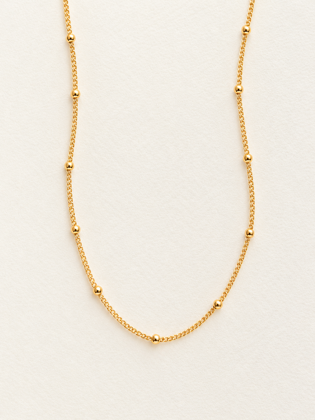 This Satellite Chain Necklace features tiny polished beads along a delicate chain for just the right amount of shine. 14k gold filled and sterling silver 