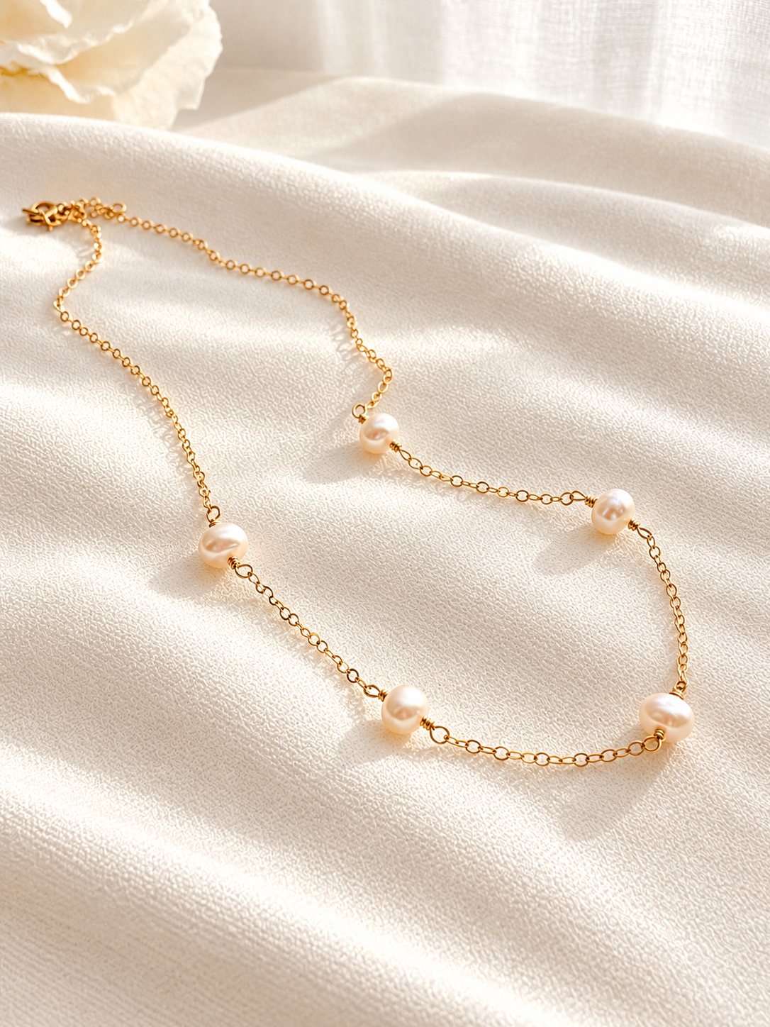 Dainty freshwater pearl station necklace available in 14K gold filled or sterling silver. Handmade with naturally unique pearls for everyday wear, layering, weddings and gifting.