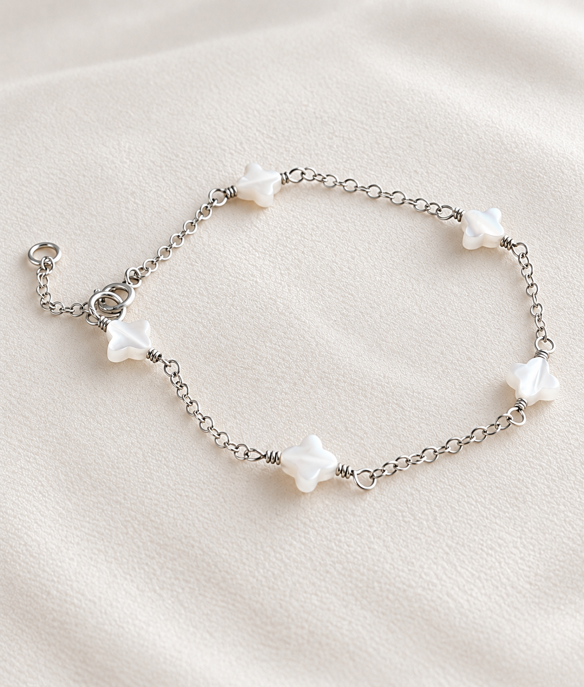Mother of Pearl clover bracelet with sterling silver chain handmade by Coco Wagner Design