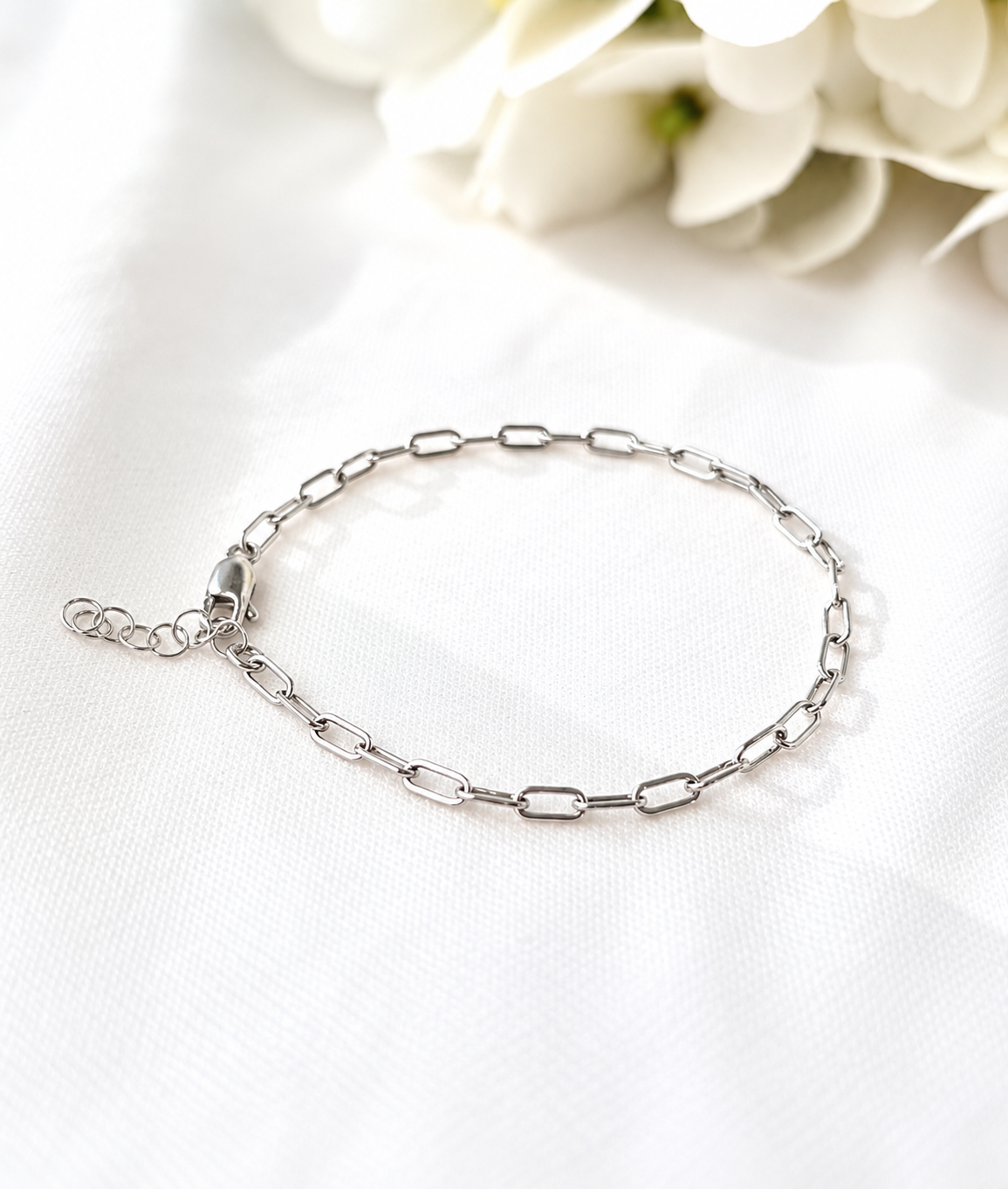 Shop a dainty paperclip bracelet handmade in Wyoming. Choose 14K gold filled or sterling silver for a minimalist, everyday bracelet made for layering.