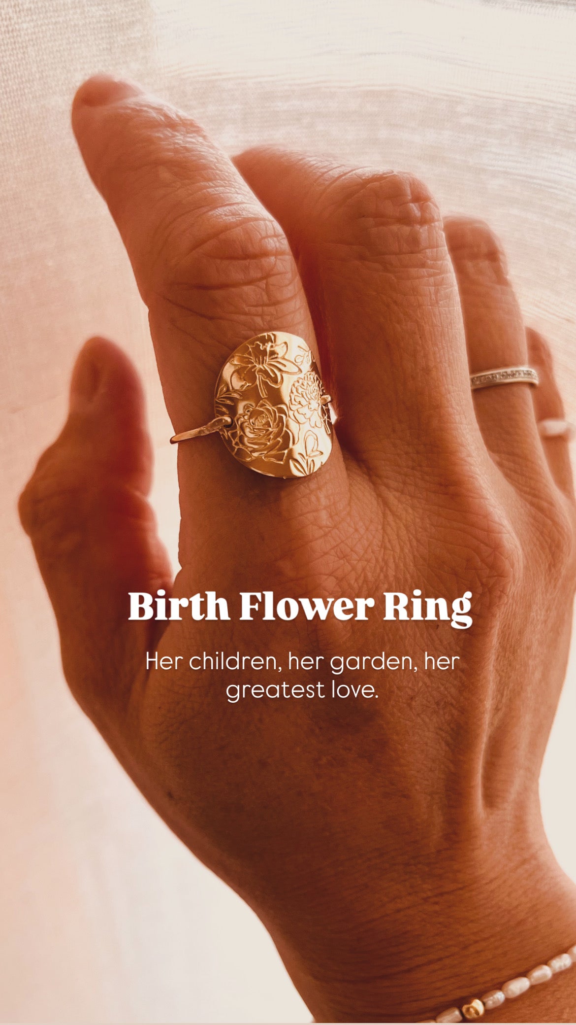 Gold personalized birth flower ring with the message: Her children, her garden, her greatest love.