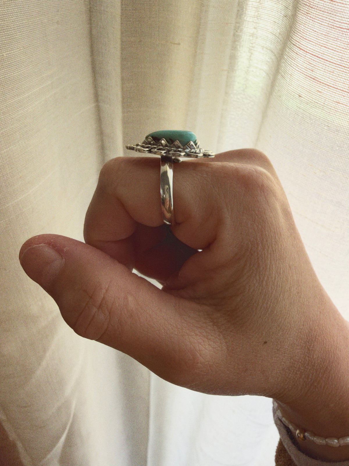 Side view of adjustable 925 sterling silver turquoise ring
