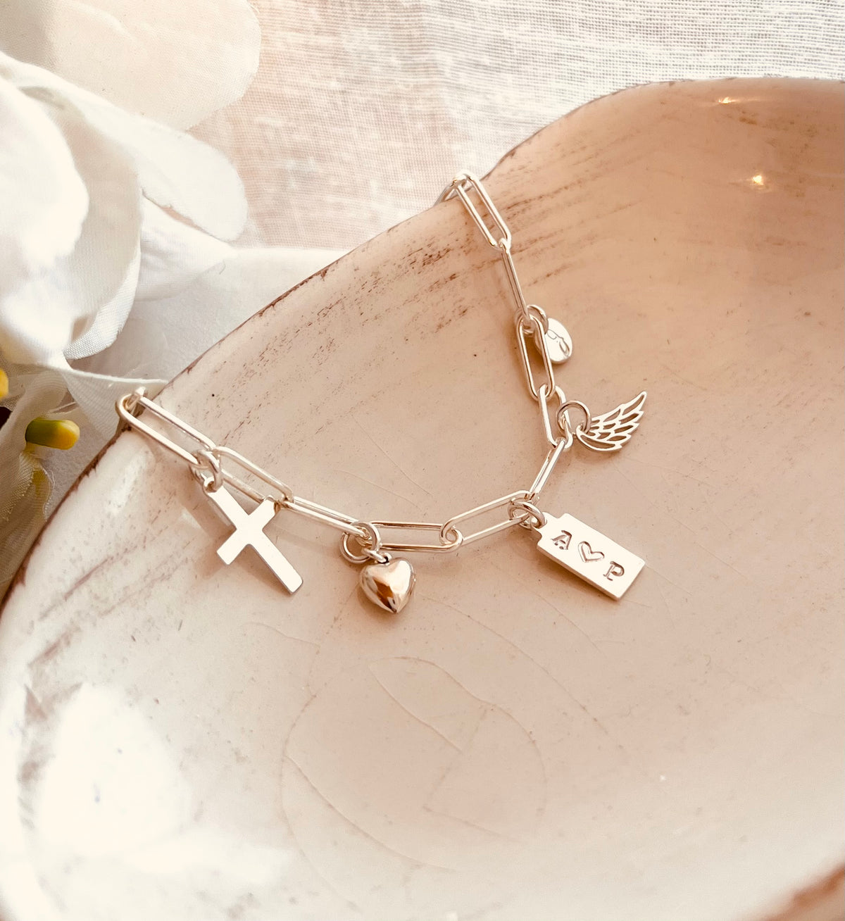 sterling silver custom charm bracelet with heart pearl cross angle wing and personalized initial charms