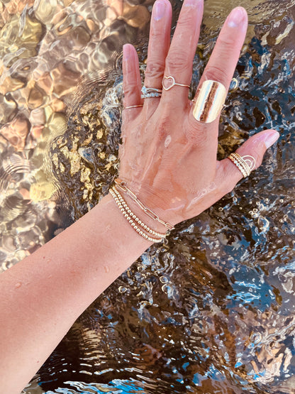 Crafted from 14K gold-filled and delicately hammered, these stylish large disc rings are the perfect statement to complete any look. They make wonderful stacking rings, but can be worn alone to add a chic touch of elegance to your wardrobe.