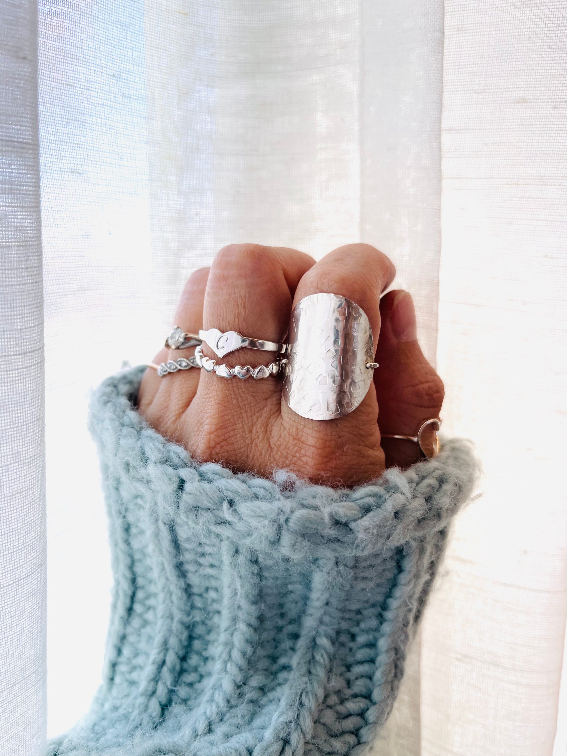 Crafted from high-quality sterling silver, this large disc ring is perfect for everyday wear. With its subtle hammered texture, the ring gives a unique, delicate touch to any stackable or statement ring set. Perfect for minimalist everyday jewelry.